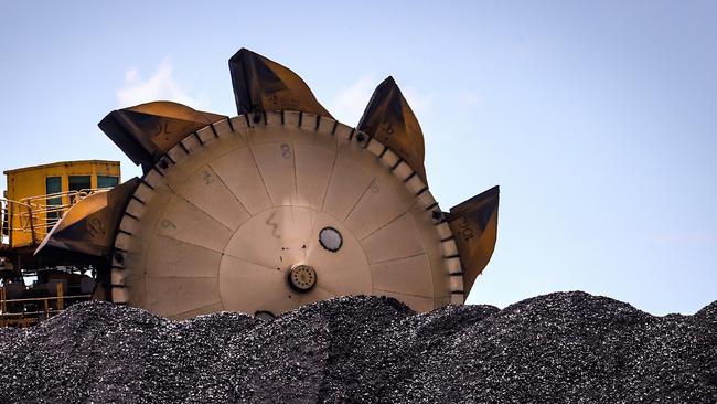 An excavator on a pile of coal at the Port of Newcastle in an election battleground, the NSW Hunter region. Picture: Bloomberg