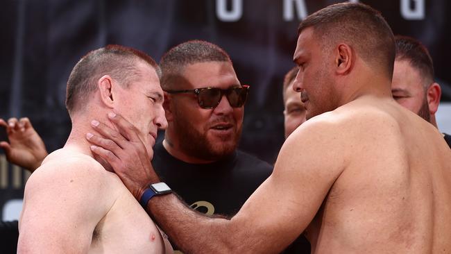 Justin Hodges grabs Paul Gallen at the weigh-in. Picture: Chris Hyde/Getty