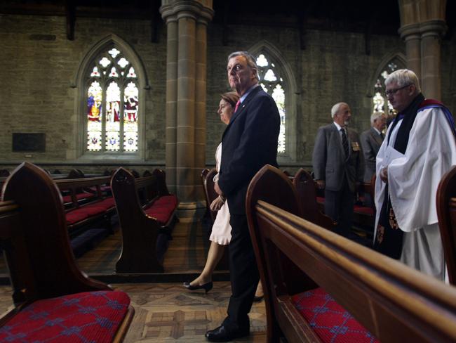 A somber moment at the 13th Annual Field of Remembrance Dedication Service at St David’s Cathedral, Governor Peter Underwood leads the service for the war widows.