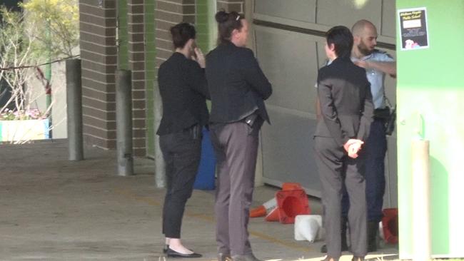 Detectives and police at the school in Bankstown. Picture: TNV