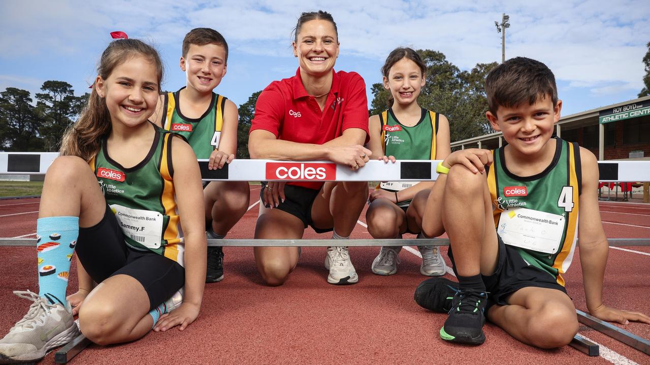 Olympic gold medallist Nina Kennedy meets Little Athletics participants Sammy, Benji, Heidi and Jack from Sandringham Little Athletics Club. Picture: Martin Keep/Coles