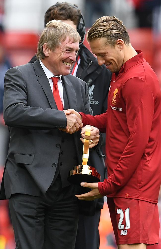 Liverpool's Brazilian midfielder Lucas Leiva (R) and Liverpool's Scottish former manager Kenny Dalglish
