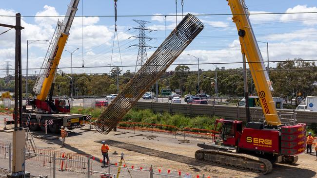 The Toorak Rd level crossing is set to be gone six months ahead of schedule. Crews are installing 18 concrete columns to support the new rail bridge.