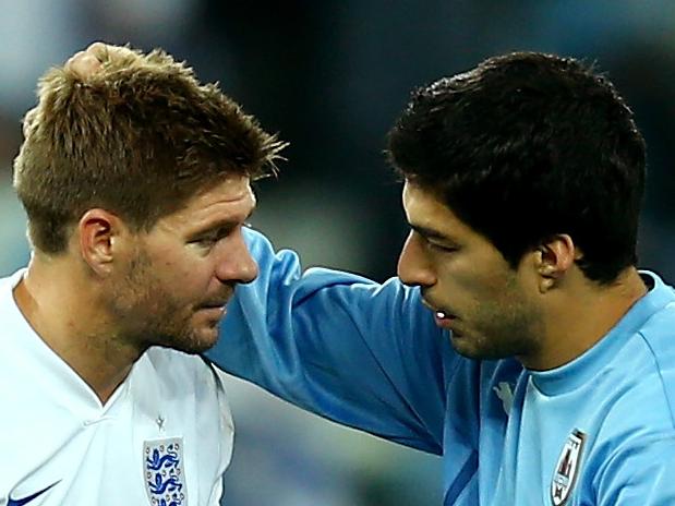 SAO PAULO, BRAZIL - JUNE 19: Steven Gerrard of England speaks to Luis Suarez of Uruguay after Uruguay's 2-1 win during the 2014 FIFA World Cup Brazil Group D match between Uruguay and England at Arena de Sao Paulo on June 19, 2014 in Sao Paulo, Brazil. (Photo by Clive Rose/Getty Images)