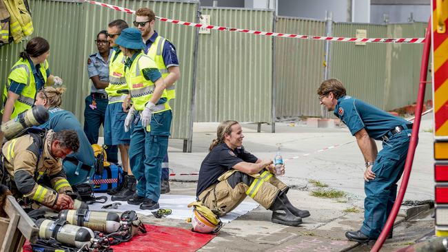 Exhausted fire fighters take a break. Picture: Jerad Williams