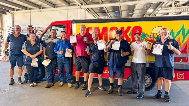 The staff at Bob Parkes Automotive were celebrating after receiving a visit from Getta Betta's Smoko Smash van. Picture: Supplied.