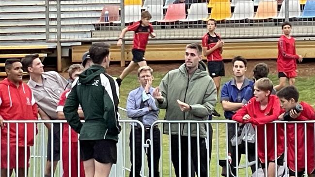 Two-time Olympian Cedric Dubler helps one of the young BBC jumpers.