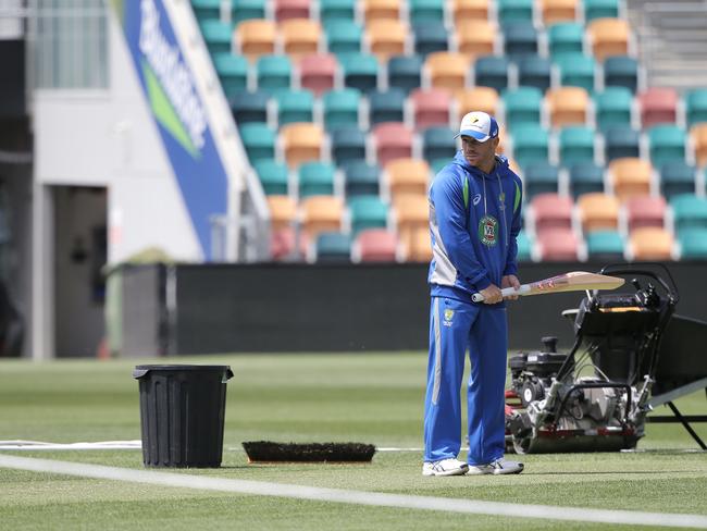 CRICKET: Wednesday 9th November 2016, Blundstone Arena: Australian opener David Warner takes guard on the pitch being prepared for the second test against South Africa. Picture: LUKE BOWDEN