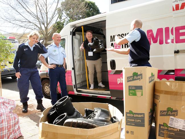 Mission Australia receiving donation of police boots. Picture: Annika Enderborg