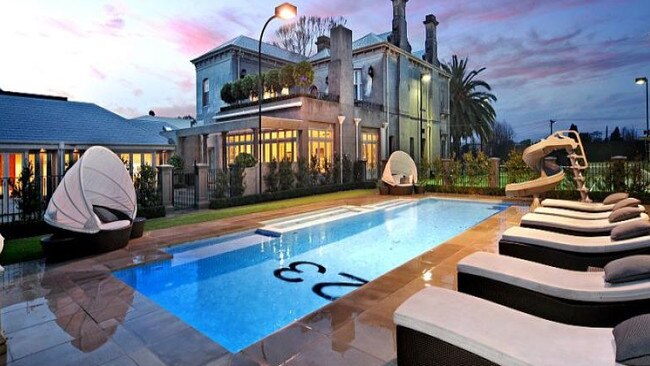 Shane Warne's Brighton mansion with his test cricket number on the bottom of the pool.