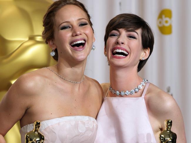 Jennifer Lawrence and Anne Hathaway at the 2013 Academy Awards.