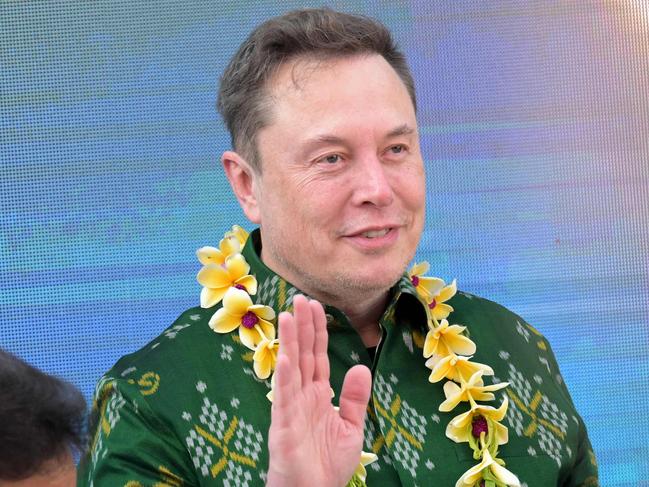 Tech billionaire Elon Musk (R) gestures upon arriving to inaugurate satellite unit Starlink at a community health center in Denpasar on Indonesia's resort island of Bali on May 19, 2024. Musk launched on May 19 his Starlink service on Indonesia's resort island of Bali as the country aims to extend internet to its remote areas. Millions of people in Indonesia, a vast archipelago of more than 17,000 islands, are not currently hooked up to reliable internet services. (Photo by SONNY TUMBELAKA / AFP)