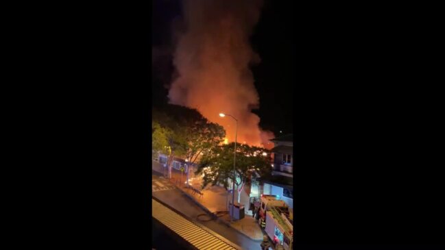 Police declare crime scene after fire tears through shops