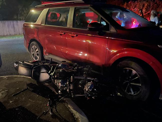 Motorbike rider was pinned under car after a crash on Slade Point Rd. Picture: Paul Brescia