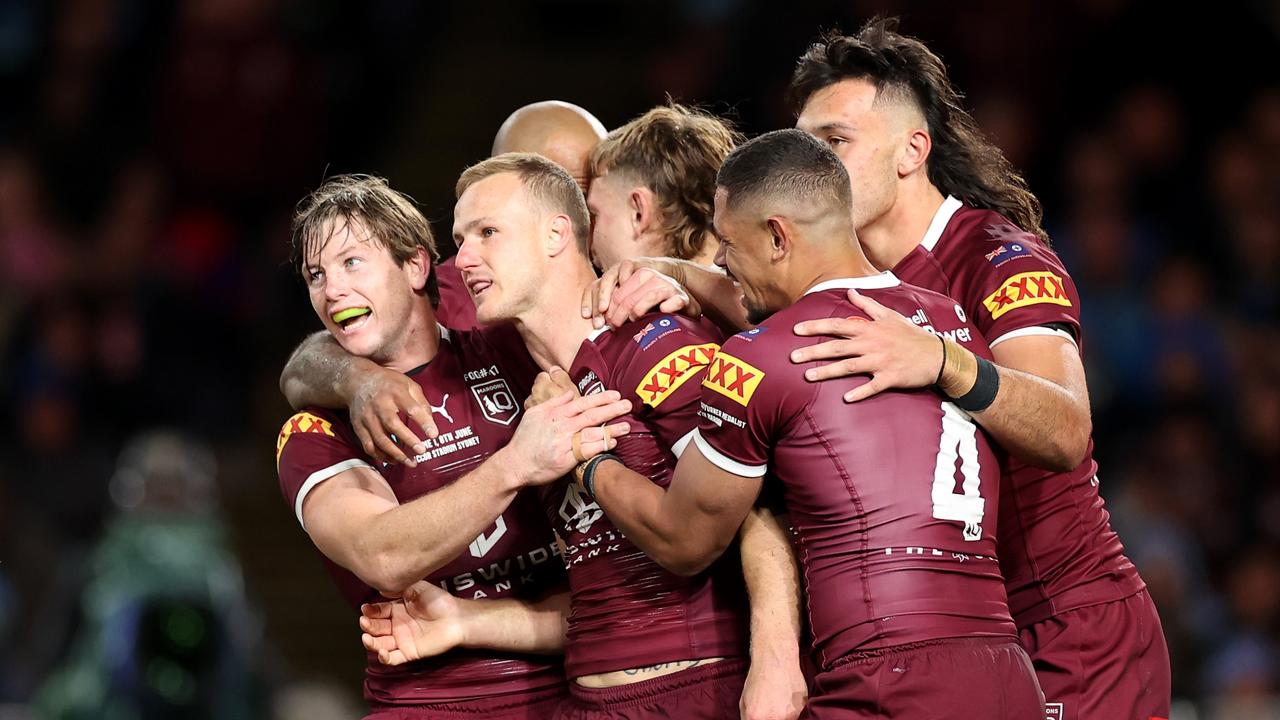 Maroons swarm Daly Cherry-Evans after his try. Picture: Cameron Spencer/Getty