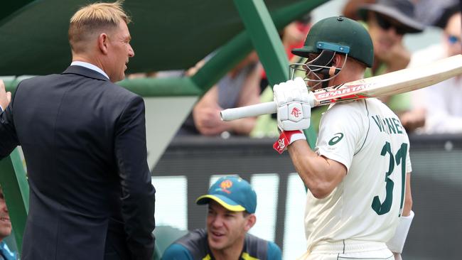 David Warner chats with Shane Warne before play at the MCG.