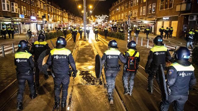 Police patrol in the streets of Rotterdam during the curfew on Tuesday night. Picture: AFP