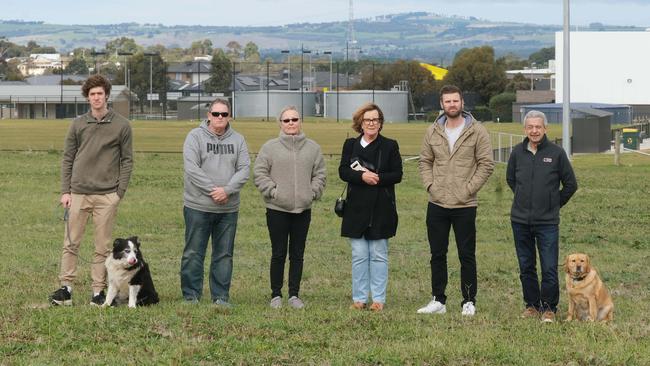 Bannockburn residents are fighting the council's decision to declare 3.5ha of Bannockburn Recreational Reserve as surplus. From left: Ben Gibbs with Bella, Daryl Charlton, Jackie Charlton, Beverley Bond, Josh Trowell and Chris Balis with Mac. Picture: Mark Wilson