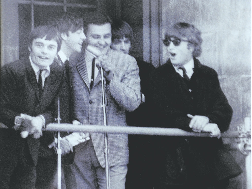 Bob Francis, front and centre with The Beatles, on the balcony of the Adelaide Town Hall, during the band’s historic visit in 1964.