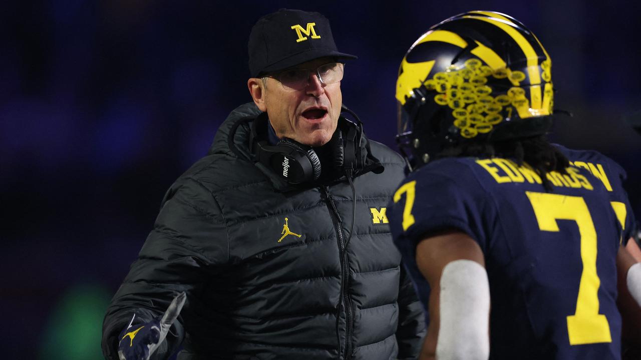 ANN ARBOR, MICHIGAN - NOVEMBER 04: Head coach Jim Harbaugh reacts after a second half touchdown while playing the Purdue Boilermakers at Michigan Stadium on November 04, 2023 in Ann Arbor, Michigan. Michigan won the game 41-13. Gregory Shamus/Getty Images/AFP (Photo by Gregory Shamus / GETTY IMAGES NORTH AMERICA / Getty Images via AFP)