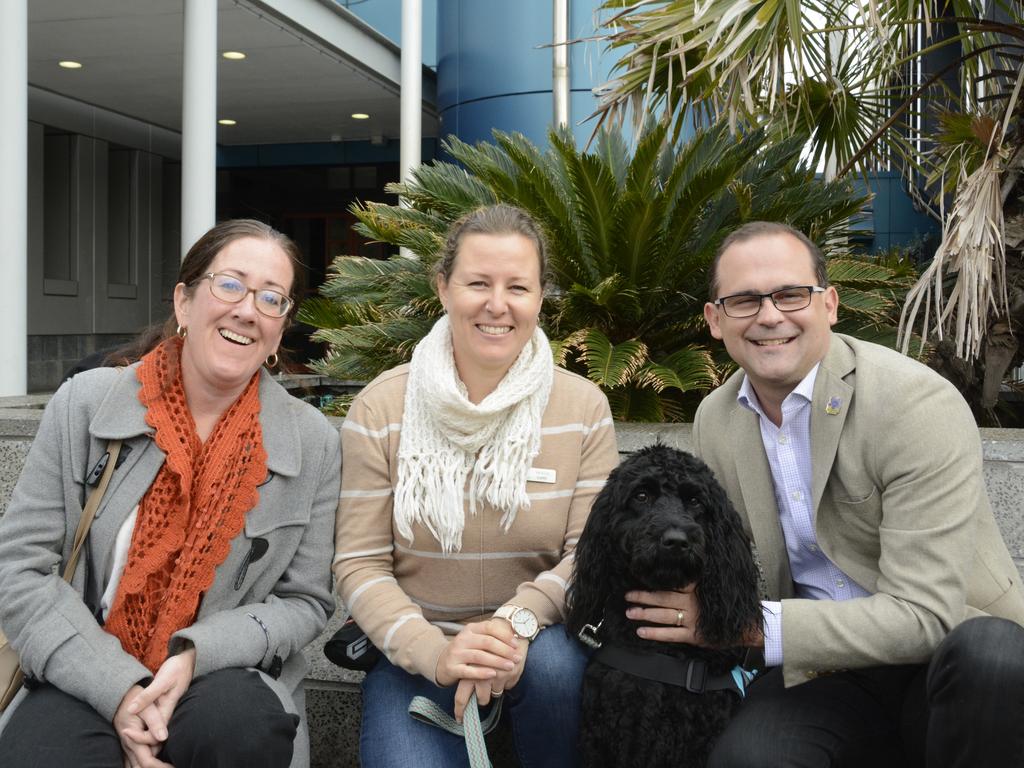 Hope's second handler Christine Bartlett, owner Vanessa Curtis, Toowoomba South MP David Janetzki and Hope, the three-year-old labradoodle, at Toowoomba courthouse.