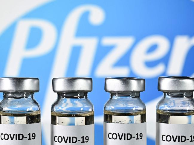 (FILES) In this file photo taken on November 17, 2020 (FILES) shows vials with Covid-19 vaccine stickers attached, with the logo of US pharmaceutical company Pfizer. - Brazilian health regulator Anvisa authorised on June 11, 2021 the use of the Pfizer/BioNTech immuniser against COVID-19 for minors over 12 years old. (Photo by JUSTIN TALLIS / AFP)