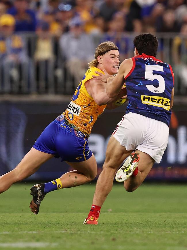 Reid fends off Christian Petracca. Picture: Paul Kane/Getty Images