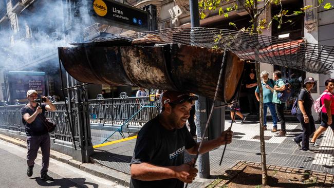 Protesters give Javier Milei’s policies a grilling in Buenos Aires on Wednesday. Picture: AFP