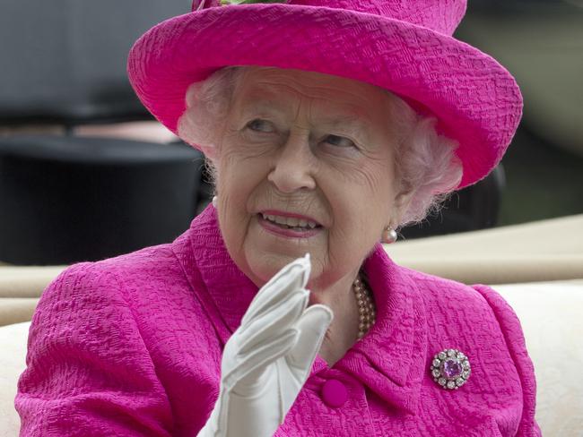 FILE - In this Thursday, June 22, 2017 file photo, Britain's Queen Elizabeth II waves to the crowd as she arrives by open carriage into the parade ring on the third day of the Royal Ascot horse race meeting, which is traditionally known as Ladies Day, in Ascot, England. Newly leaked papers have revealed that Queen Elizabeth II has placed some of her private money into offshore tax havens. According to records obtained by the International Consortium of Journalists, the queenâ€™s investment managers have placed roughly 10 million pounds ($13 million) in offshore portfolios in the Cayman Islands and Bermuda. (AP Photo/Alastair Grant, File)