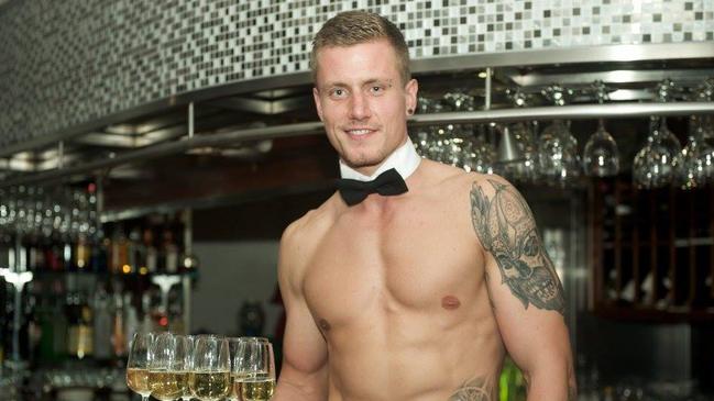 Aussie Hunks entertainer Dane serves drinks as a topless waiter. Picture: Supplied