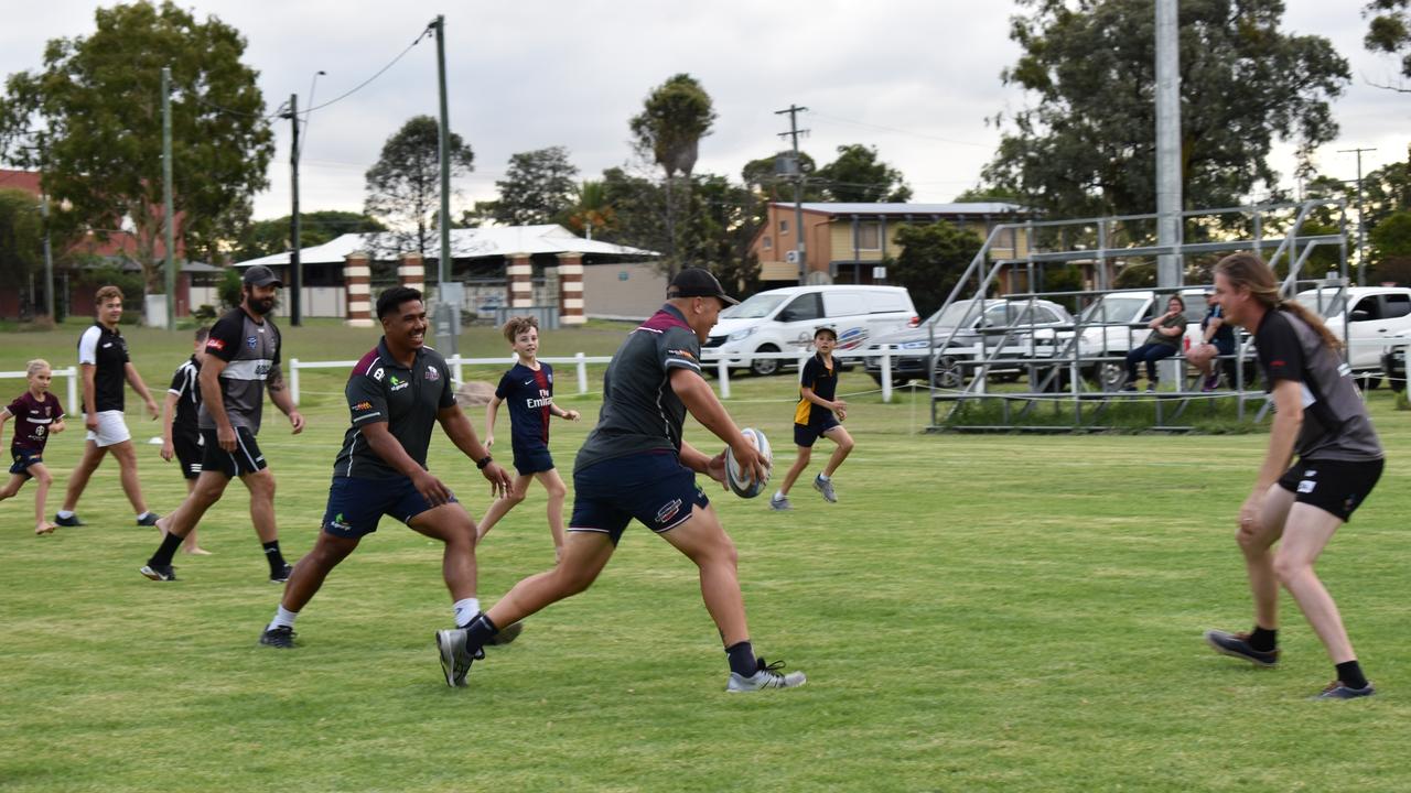 The Reds players hit the field in a mock touch footy game with Warwick Water Rats of all ages yesterday. Picture: Jessica Paul