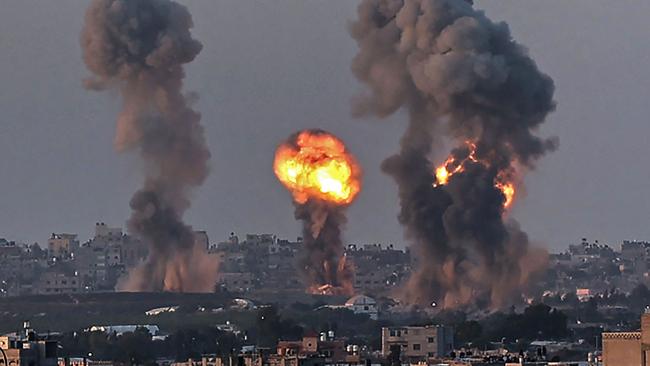 Smoke and a ball of fire rise above buildings in Khan Yunis in the southern Gaza Strip, during an Israeli air strike, on May 12. Picture: AFP