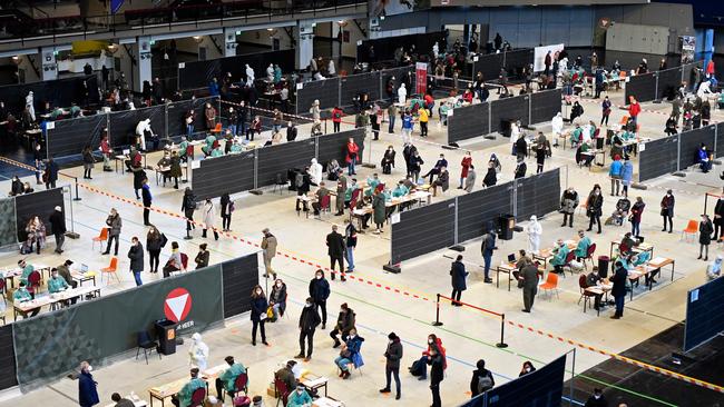 Members of the Austrian military and medical personnel administer COVID-19 tests during nationwide, mass testing in Vienna on Friday. Picture: Getty Images