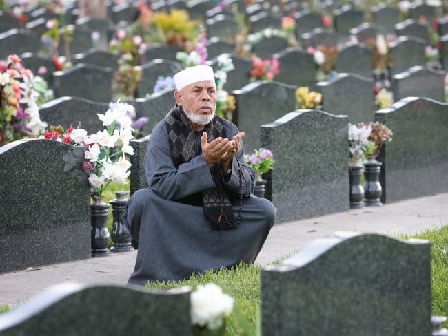 Sheik Taj Din al-Hilali tending graves in the Muslim section of Rookwood Cemetery. Picture: Bob Barker