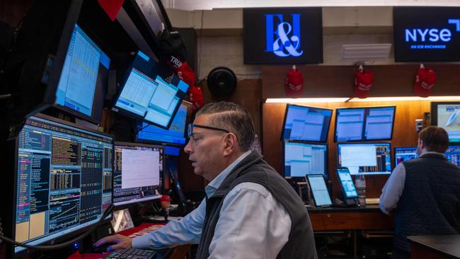 Traders work on the floor of the New York Stock Exchange moments before the Closing Bell and the start of President Donald Trump’s news conference on tariffs on April 2. Getty Images via AFP