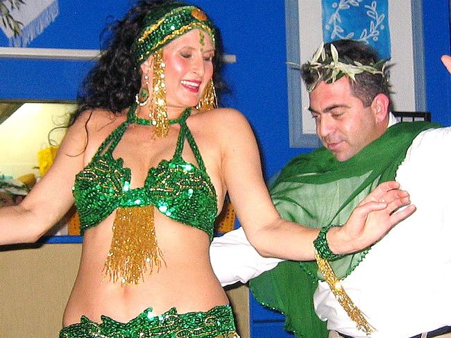 Jimmy Vasiliadis, of Mangrove Mountain, dances with Dessert Flame belly dancer at Sirens restaurant Olympic night at Terrigal. Picture: Supplied.