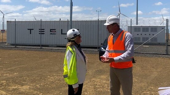 Infigen director finance and commercial Sylvia Wiggins and SA Energy and Mining Minister Dan van Holst Pellekaan at the Lake Bonney Battery.