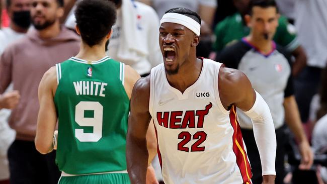 MIAMI, FLORIDA - MAY 17: Jimmy Butler #22 of the Miami Heat celebrates a basket against the Boston Celtics during the third quarter in Game One of the 2022 NBA Playoffs Eastern Conference Finals at FTX Arena on May 17, 2022 in Miami, Florida. NOTE TO USER: User expressly acknowledges and agrees that, by downloading and or using this photograph, User is consenting to the terms and conditions of the Getty Images License Agreement.   Michael Reaves/Getty Images/AFP == FOR NEWSPAPERS, INTERNET, TELCOS & TELEVISION USE ONLY ==