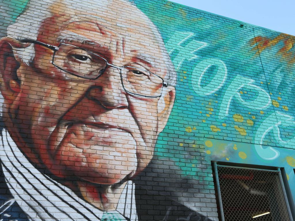 Artist Heesco and Maribyrnong Mayor Nam Quach with the new Malcolm Fraser mural. The mural has recently been painted on the wall of the Asylum Seekers Centre in Footscray. The Mayor's parents arrived by boat from Vietnam and, like many in the Vietnamese community, credit Fraser for bringing them to new safer lives in Australia. Picture: Mark Wilson