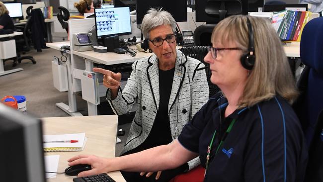 Victorian Governor Linda Dessau sits alongside ESTA operator Sue as she takes calls at the Burwood East centre.