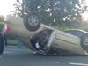 Police probe car rollover near busy Hungry Jack’s