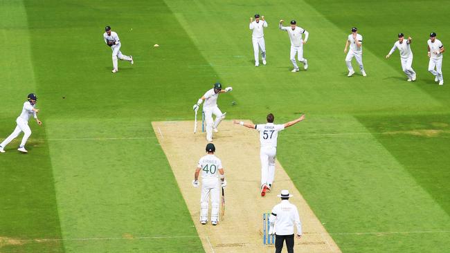 Ollie Robinson of England bowls out Dean Elgar. Photo by Mike Hewitt/Getty Images