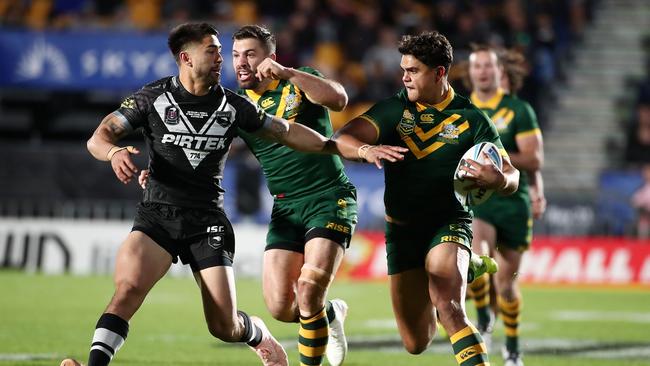 Latrell Mitchell fends off Shaun Johnson during the Trans Tasman rugby league international between New Zealand and Australia. Picture: AFP