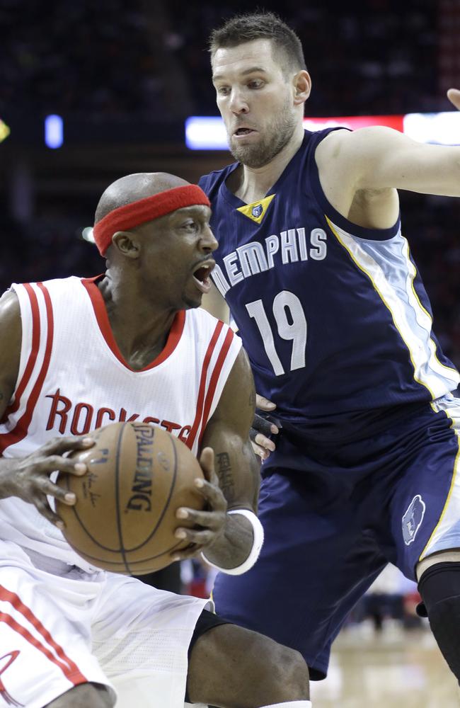 Memphis Grizzlies' Beno Udrih looms over Houston Rockets' Jason Terry.