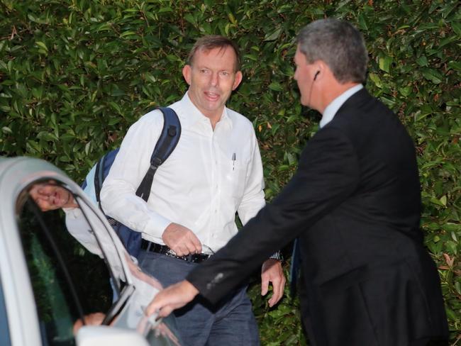 Prime Minister Tony Abbott makes his way to his armoured BMW in Canberra this morning. Picture: Gary Ramage