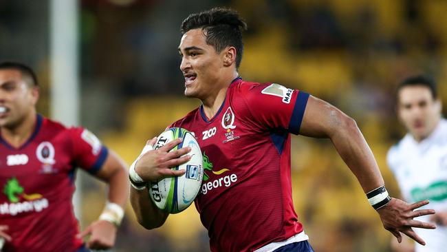 Reds debutant Jordan Petaia on his way to scoring a try.