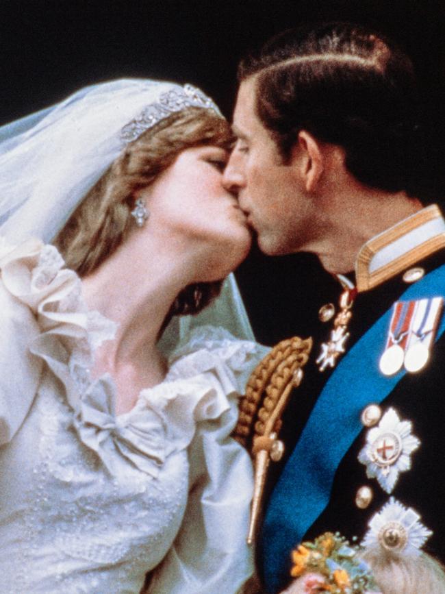 Charles and the late Princess Diana were the first royal couple to kiss on the iconic balcony. Picture: POOL / AFP