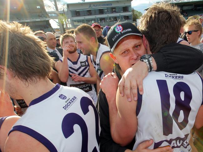 Burnie coach Brent Plant hugs Robbie Fox after their 2012 TSL grand final win.