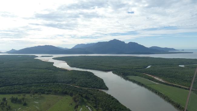 The Herbert River flowing into the Hinchinbrook Channel with Hinchinbrook Island in the background. Photographs taken by Christiane Birkett aboard a gyrocopter piloted by husband Dan Birkett. Picture: Christiane Birkett