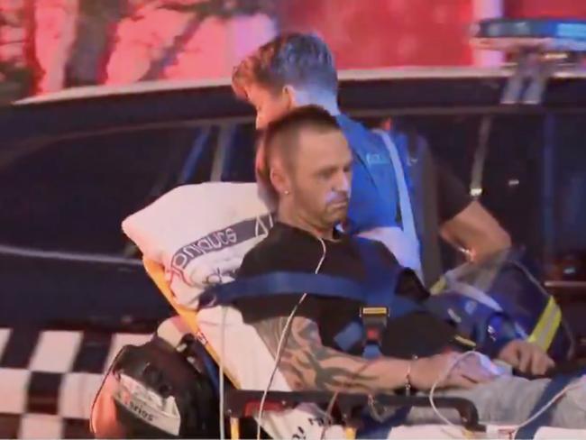 A man is rolled away on a stretcher after a major incident in South Melbourne. Picture: Nine News